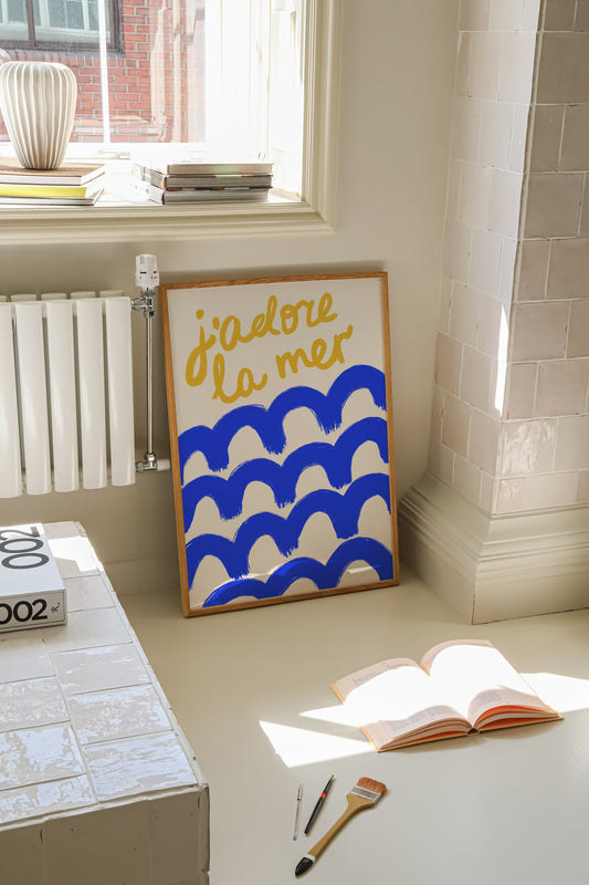 hand-drawn bold blue waves golden yellow j'adore la mer lettering cream background French coastal art print
