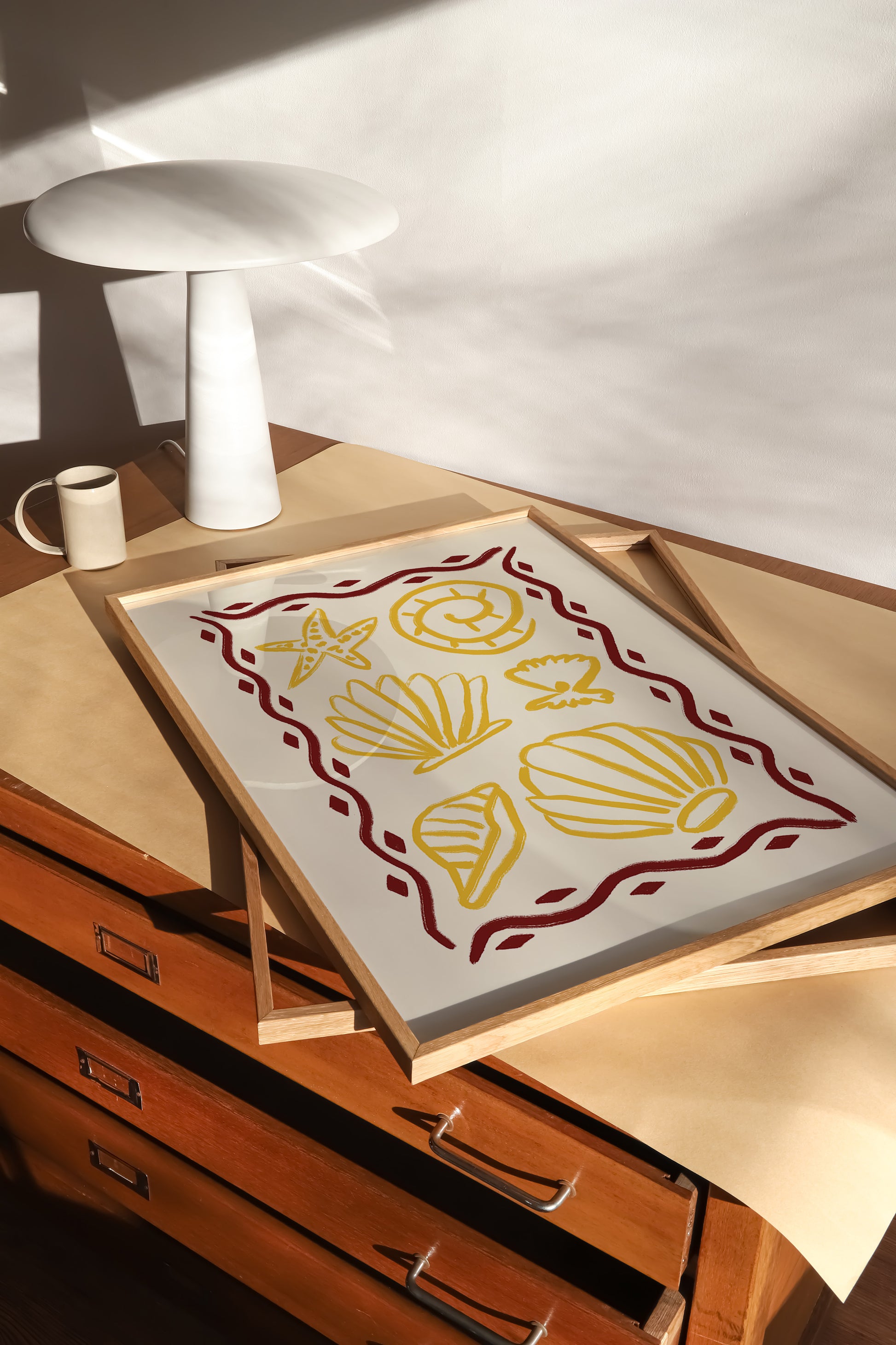 hand-drawn golden seashells starfish dark red decorative border cream background coastal art print
